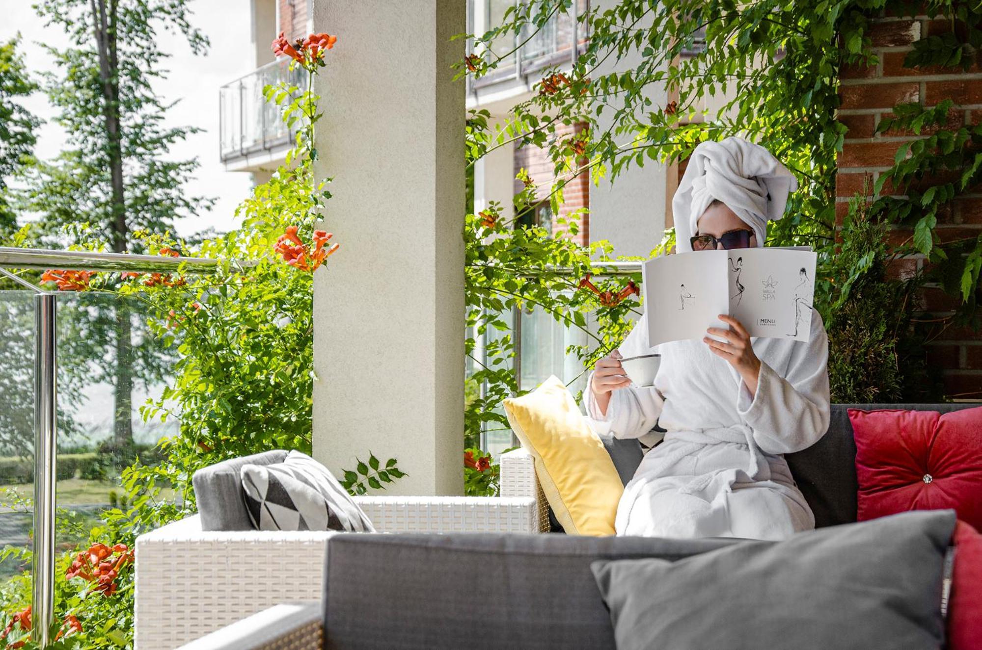 Willa Port Ostroda Exterior photo A woman relaxing at the spa
